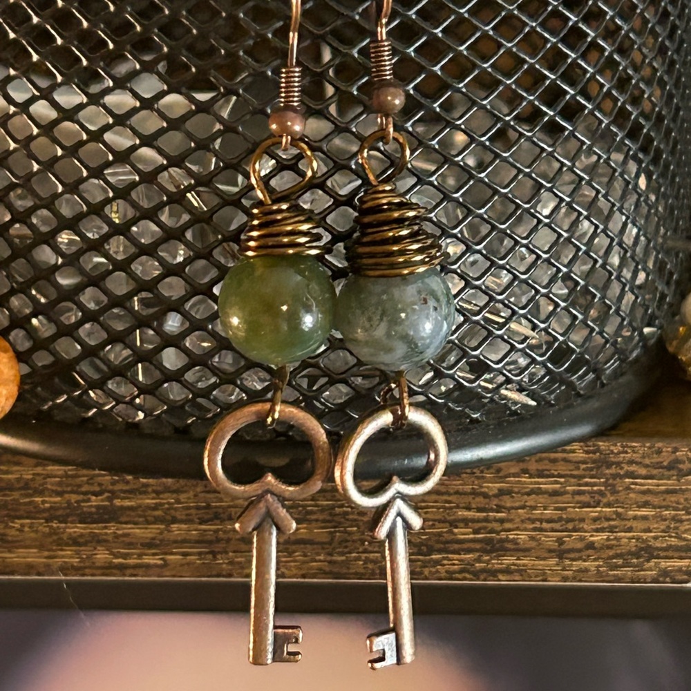 Guilded key lotus earnings in Antique brass